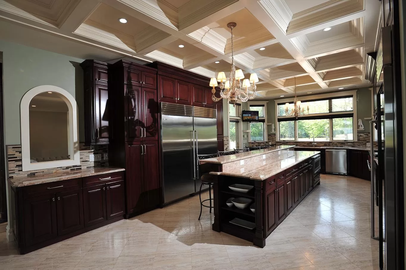 Custom kitchen with cherry cabinetry, granite island, and coffered ceiling